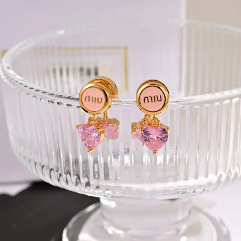 miu miu boucles doreilles pour femme s_12520311